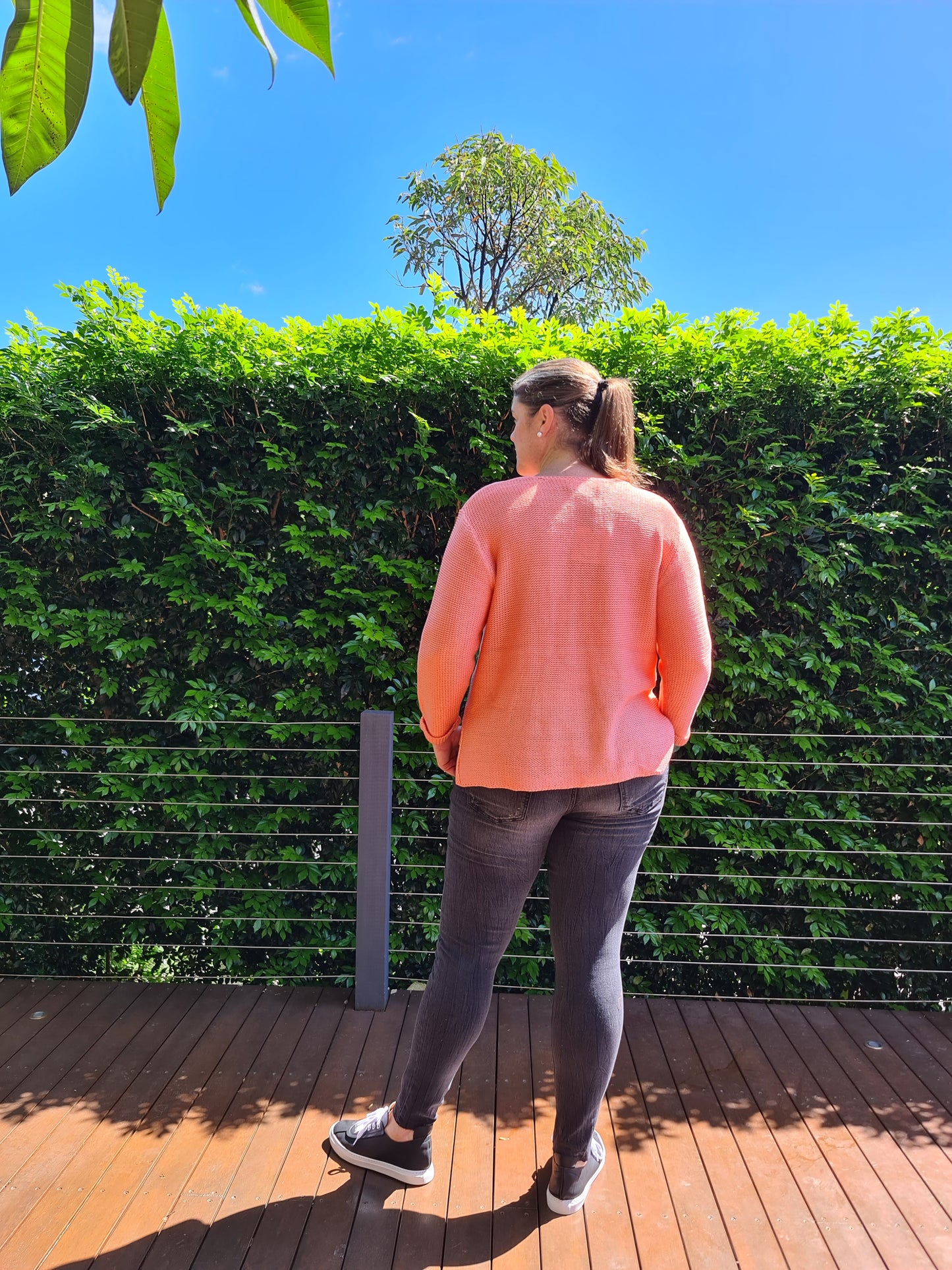 v neck knit, 100% cotton, high low hem with side split, cuffed sleeve, versatile, top pick, wardrobe staple, must have, winter 2022, autumn 2022, so in style, easy to wear, comfortable, colours pop, support small business, online, coral, navy, Bessie Knit