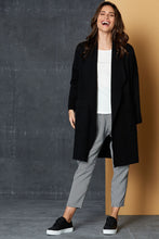 Load image into Gallery viewer, The Mellow Cardi in Black.  Another versatile piece by eb&amp;ive that will take you anywhere, anytime!  Knee length, with front pockets and a soft lapel, this block knit, open cardigan will look great partnered with jeans, joggers or a skirt.  This cardigan is super soft, yet has enough weight to keep you nice and toasty.  Available in several colours, one size.  Made from 50% viscose, 29% elastane, 21% polyamide.
