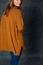 Load image into Gallery viewer, The Mellow Knit in Amber, by eb&amp;ive, is the perfect piece for dressing up or down.  This gorgeous block knit comes in several colours &amp; sizes.  It has a v-neckline, front pockets, drop shoulders, side vents and is slightly longer at the back.  Whether you are partnering it with joggers, leggings or your favourite jeans, you can&#39;t go wrong with this versatile piece.  Made from 50% viscose, 29% elastane, 21% polyamide.
